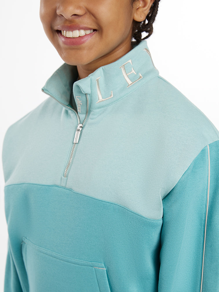 Indlæs billede i Gallery Viewer, SS25 Young Rider Kate Quarter Zip Sweat Lagoon
